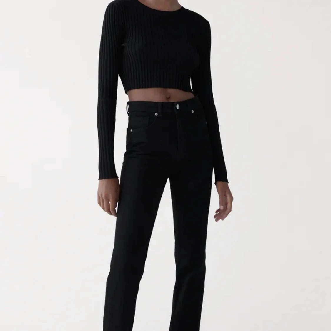 Svarta jeans med slits