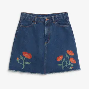 dark denim skirt with red flower embroidery and strong denim, worn only a few times so basically new condition 