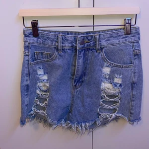 Jeans shorts - Blue jeans shorts with rips. Recently bought, never been worn.