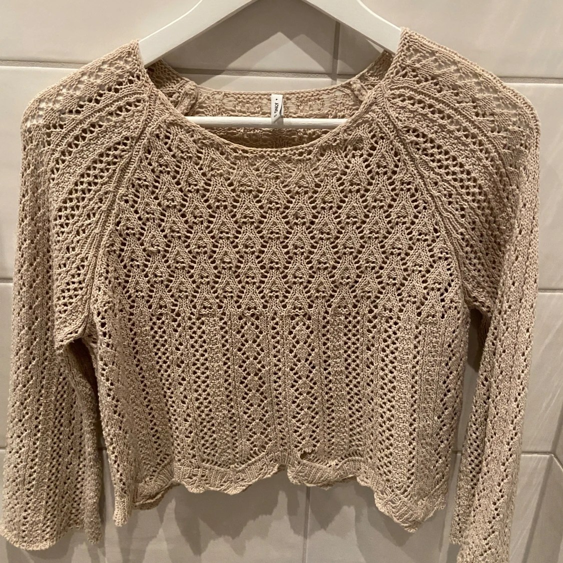 Beskurna stickad tröja