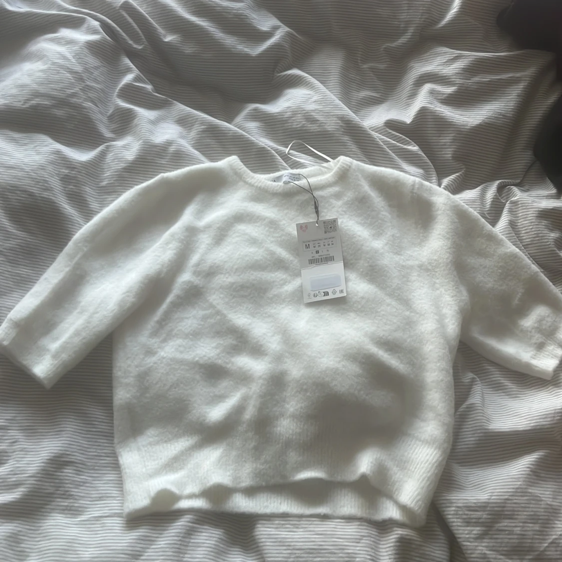 Kortärmad stickad tröja