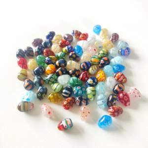 180 Glass beads in different colours, drop shape.