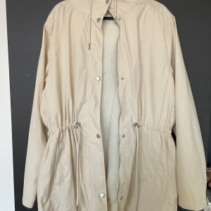 Water repellent jacket - Super pretty cozy and warm jacket. Has Teddy inside. The outside material is water repellent. (not waterproof).  Size L/ XL