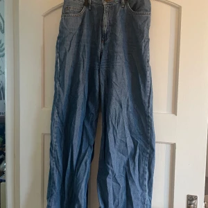 Lee Jeans - Vintage baggy Lee Jeans i storlek W28