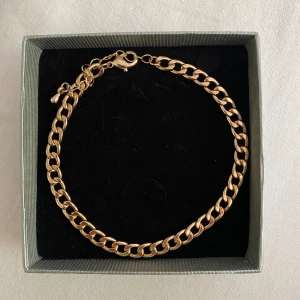 Fotlänk - Guldfärgad fotlänk. Aldrig använd.