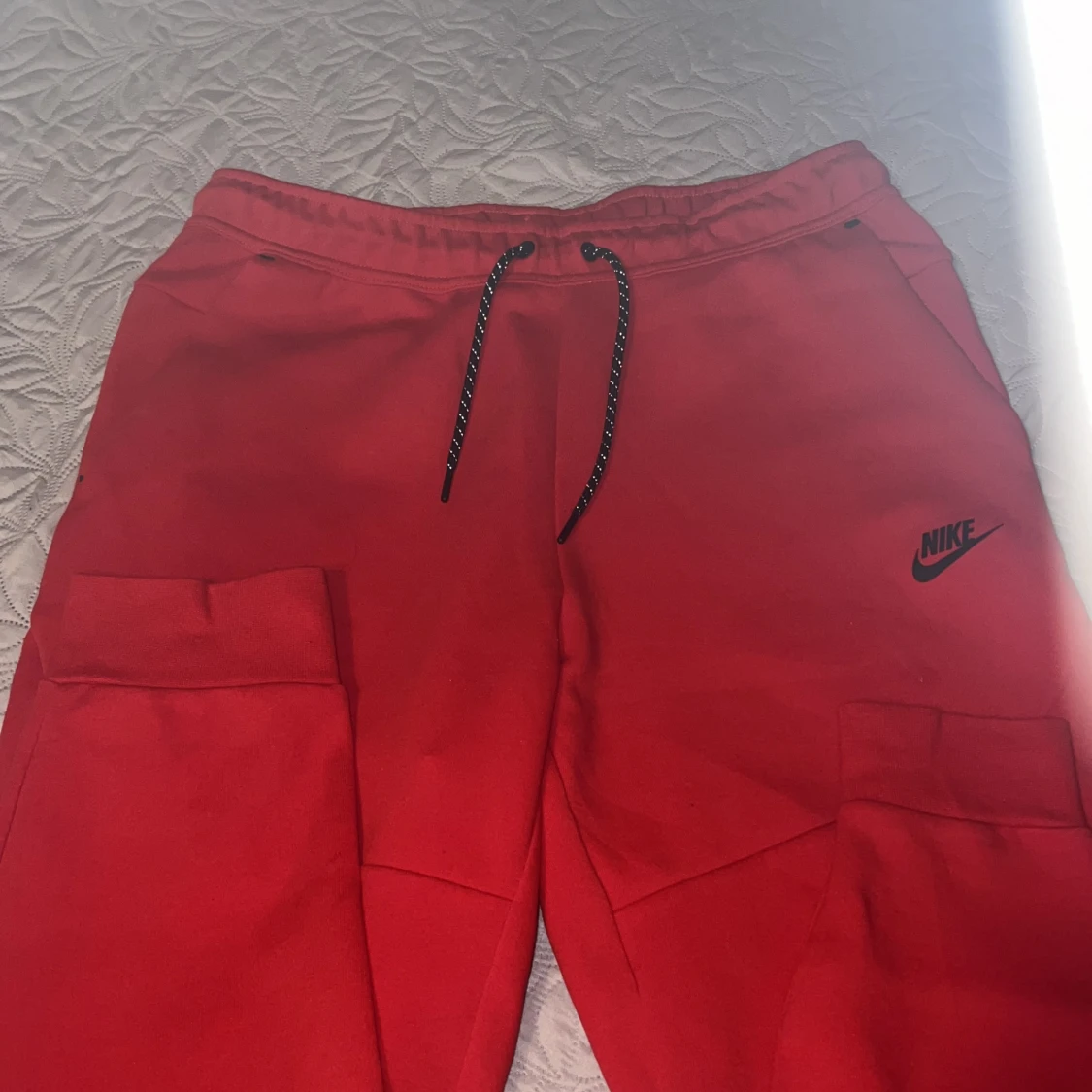 Röda Nike byxor - 90