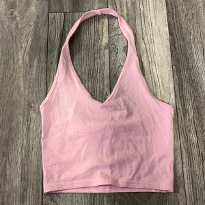 ljusrosa haltertop - ljusrosa haltertop från H&M i bra skick, bara använd fåtal gånger, storlek S 