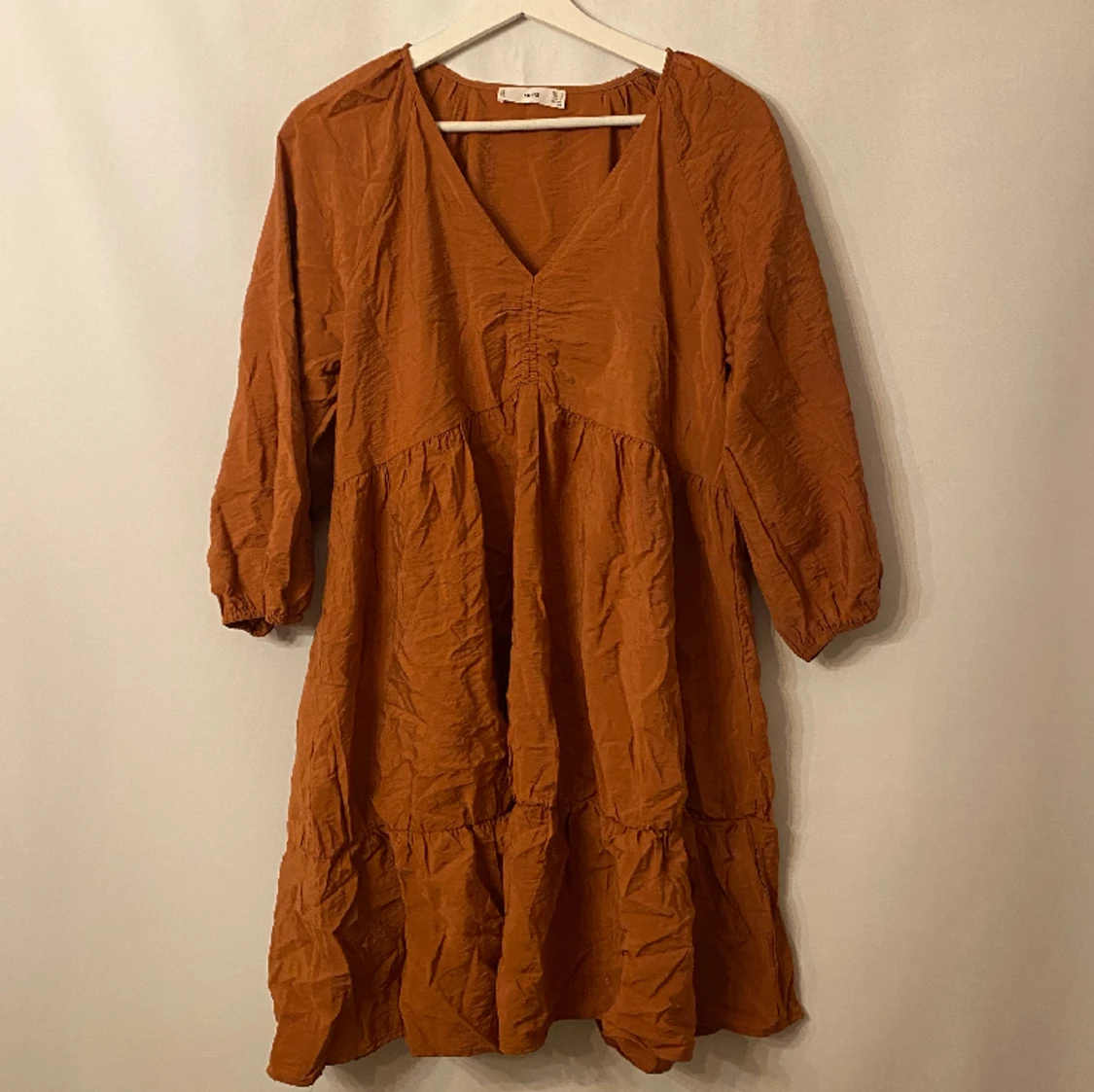 Bronsfärgad klänning