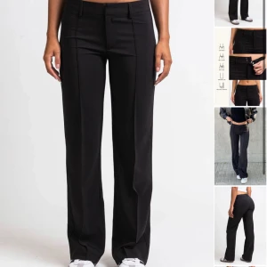 Madlady kostymbyxor  - Kostymbyxor från madlady. Nedsläppta längst ner ( se bild 2 ) men går att sy upp Storlek 32 längd 26. Nypris 600