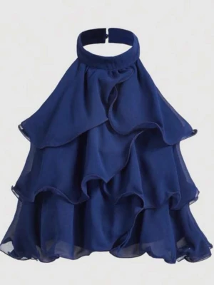 Volang topp med halterneck - Snygg marinblå topp med halterneck och flera lager volanger. Knäpps bak i nacken. Passar perfekt med ett par jeans till en middag eller fest! Endast provad då den tyvärr inte kommer till användning💓 