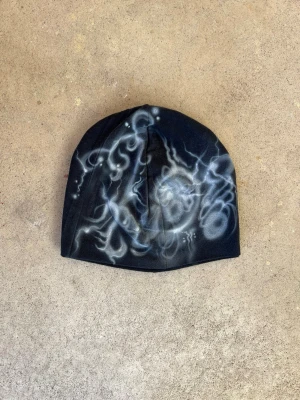 Airbrushed patchwork beanie - Sewn by us from old fabric scraps and airbrushed by Shamo