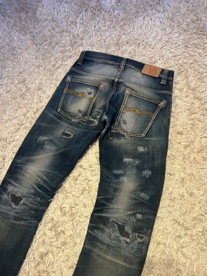 Nudie jeans replica thinn finn 30 proto archive fade wash lagning - Nudie jeans modell thinn finn replicas. Sjukt snygg och unik tvätt samt lagningar som talar för sig själv. Storlek 30/32 slim passform, nytt skick. Hojta till vid frågor. Postas antigen samma dag sol köp eller dagen därpå🙌💯