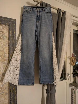 Wide leg jeans  - Fancy lace wide-leg jeans in a light wash.