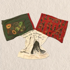 Flerfärgad topp med tryck - Unik offshoulder topp med vida ärmar i rött och grönt, dekorerad med fruktmotiv och handskrivna texter. Toppen har en croppad passform och soprent konstnärligt uttryck och  kreativ stil.