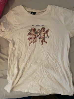 ”Don’t call me angel” T-shirt - T-shirt från GinaTricot med trycket ”Don’t call me angel”. Storlek M, sitter som S.