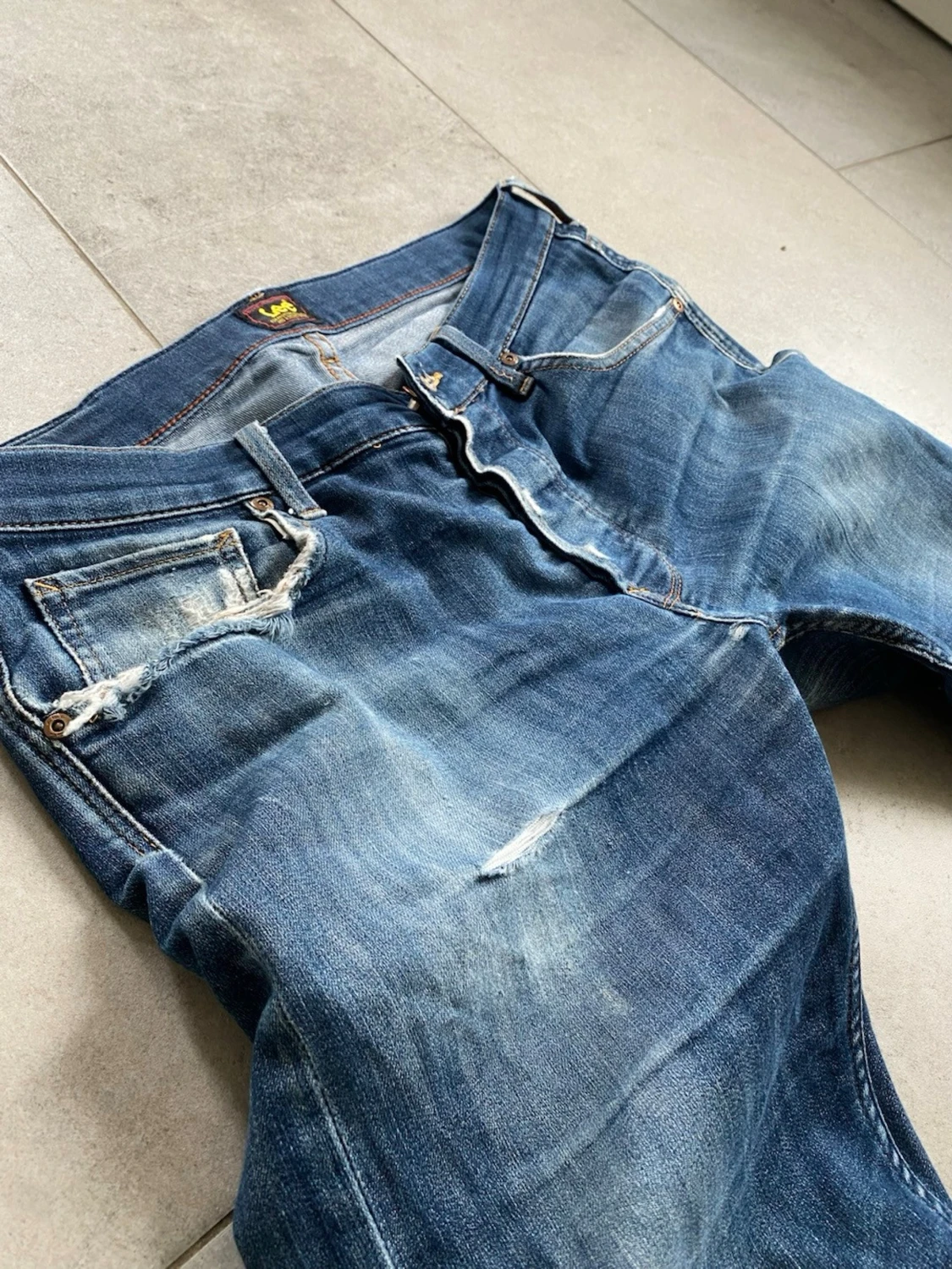 Blå slitna jeans från Lee - 1