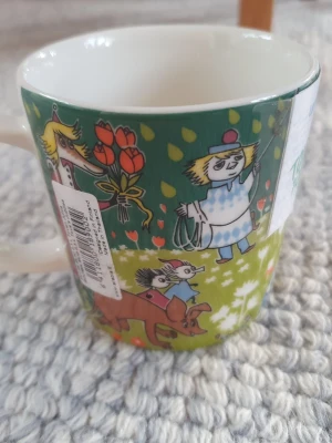 Muminmugg Toves Jubileum Mumin  - Utgången felfri mugg med etikett kvar. Packar mycket bra. 