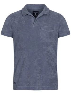 Blå frotté pike med krage - Snygg blå topp i mjuk frotté med klassisk krage och korta ärmar. Toppen har en bröstficka och enkel, avslappnad passform. Perfekt för dig som gillar en chill och stilren look.