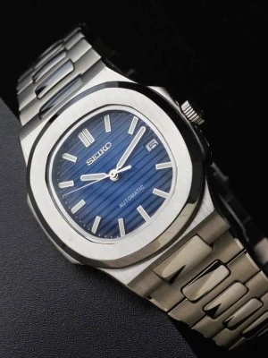 Seiko Nautilus Mod ‘5711’ Blue Dial 40 - -Movement: NH35 Seiko -Case Size: 40mm -Crown: Screw-down -Water Resistance: 100m -Crystal: Sapphire Glass -Lume: Super Lume -Bracelet: Full link bracelet included