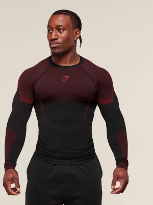 Svart och vinröd träningströja Gymshark - Tight långärmad Onyx träningströja från Gymshark i svart med vinröda detaljer på axlar, armar och bröst. Tröjan har rund halsringning och är tillverkad i ett stretchigt funktionsmaterial som andas, perfekt för gym eller löpning.