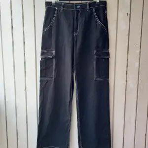 Black pants with wide legs and contrast white stitching. They are high waisted and the legs are longer than average, they are good for platform boots or heels. The fabric is nice thick cotton. Length 108 cm/waist 42 cm/hips 54 cm/size on the label 40 (L)