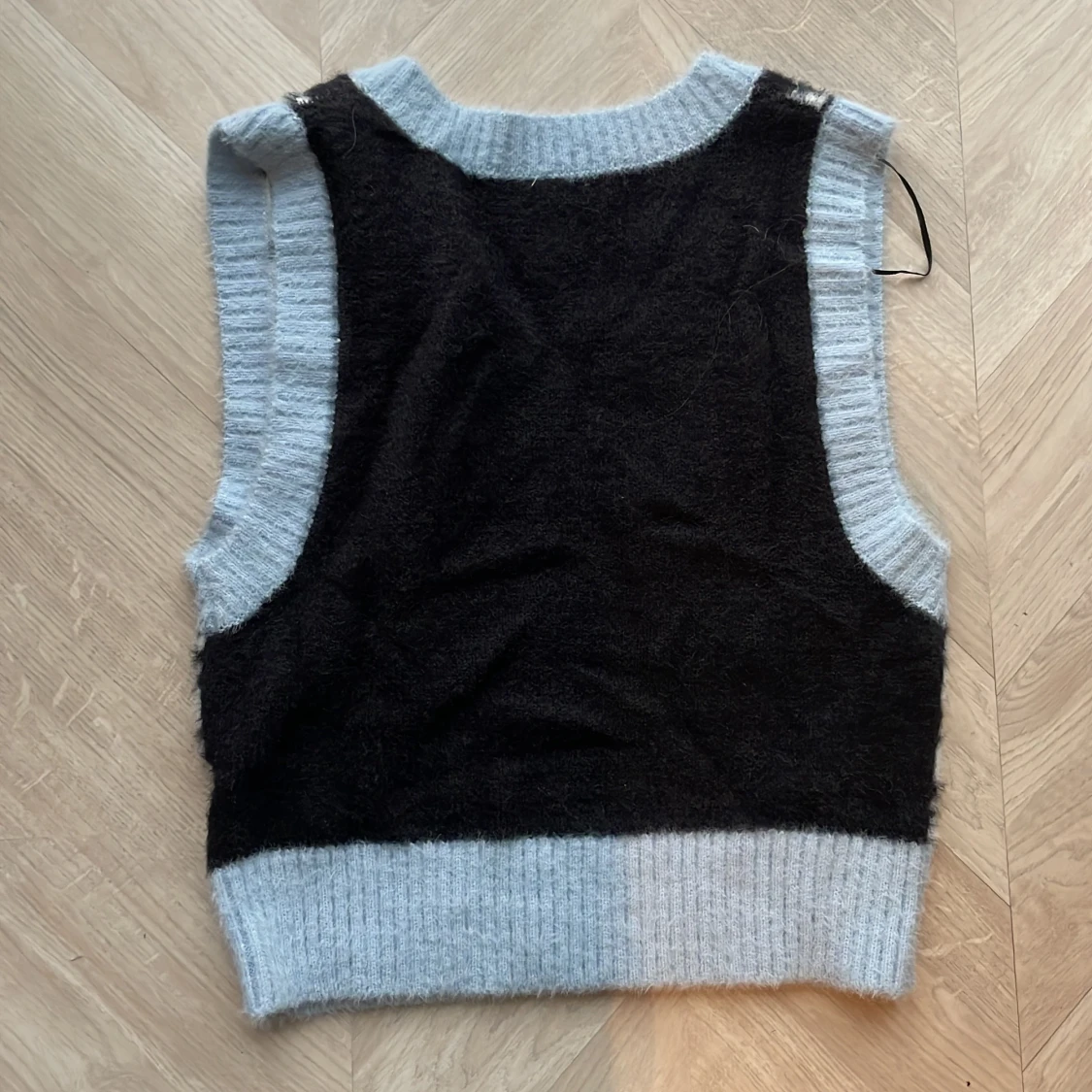 Pepitarutig ljusblå väst - 91