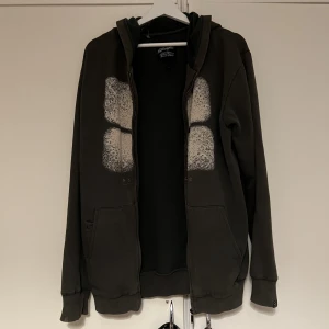 grön hoodie med abstrakt tryck  - grön oversized zip-up hoodie med coolt abstrakt tryck i mitten 