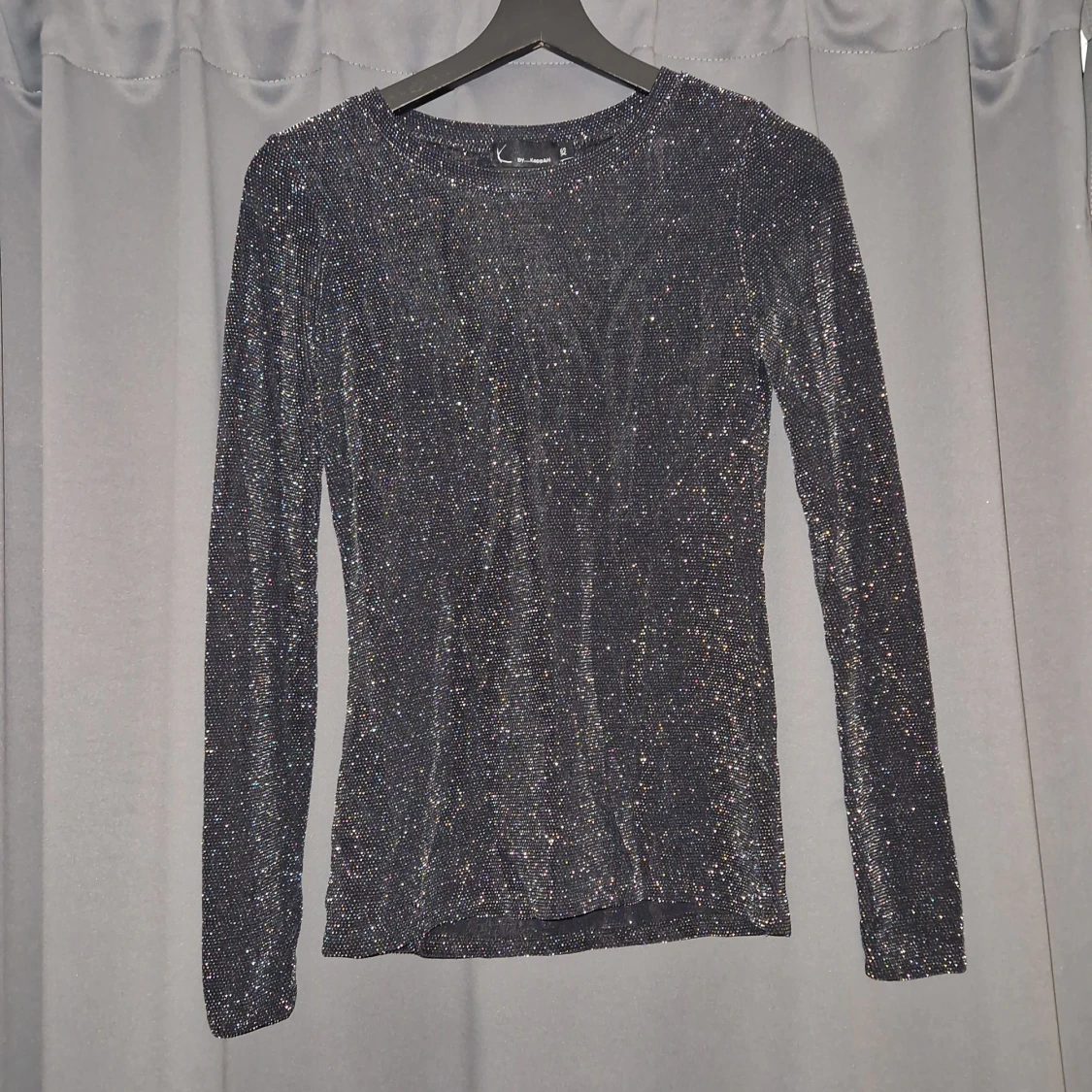Glittrig tröja