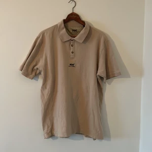 Helly Hansen piké - Fin baggy Hwlly Hansen pike i storlek XL