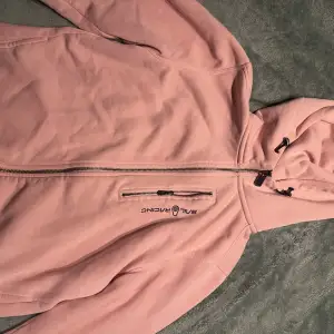 En rosa sail racing tröja i storlek S