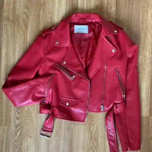 Red leather jacket from Stradivarius, waist length.  Size Small.  Barely used (Good condition)