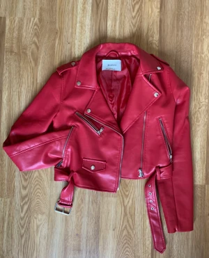 Red leather jacket - Red leather jacket from Stradivarius, waist length.  Size Small.  Barely used (Good condition)