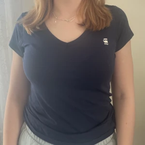 T-shirt  - Blå T-shirt storlek XS!