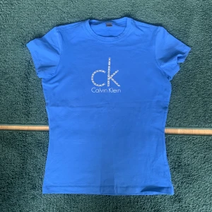 Calvin Klein Babytee - Calvin Klein babytee with rhinestones on lettering, got from my mom from the 2000s, never worn