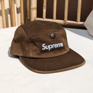 Box logo Supreme 5 Panel Cap with front pocket. Color is sage (or military green). Little use. Condition is very good.