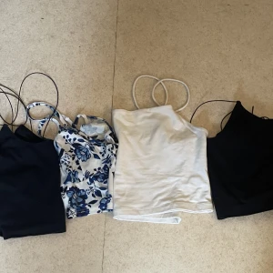 4 st linnen  - 4 st linnen alla i storlek L. Kostar tillsammans 120kr. 2 st svarta linnen från bikbok. 1 vit och blå blommig linne från shein. 1 vit linne från Gina tricot 