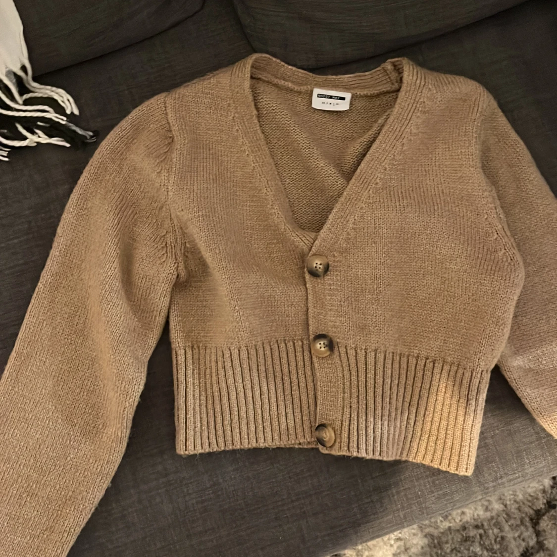 Kofta med stora knappar