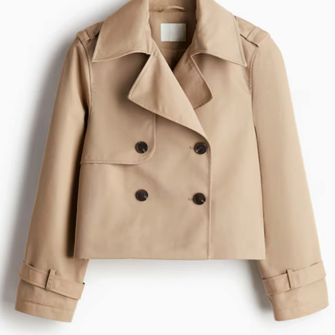 Beige trenchcoat med knappar