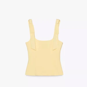 Gul topp Zara - Supersöt ljusgul topp med breda axelband som knyts i rosetter från Zara. Aldrig använd med prislapp kvar eftersom den är för stor för mig. Kontakta mig för fler bilder💗