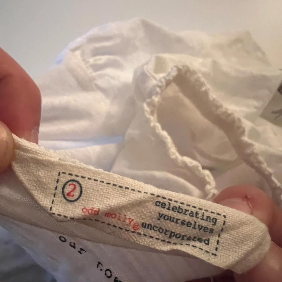 Vit kortärmad topp med rosett - 1