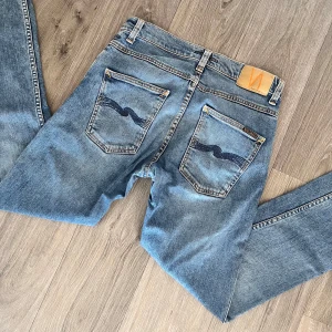 Nudie jeans - Nudie jeans | Modell Grim Tim | Super fint skick | Storlek W31 L32. 