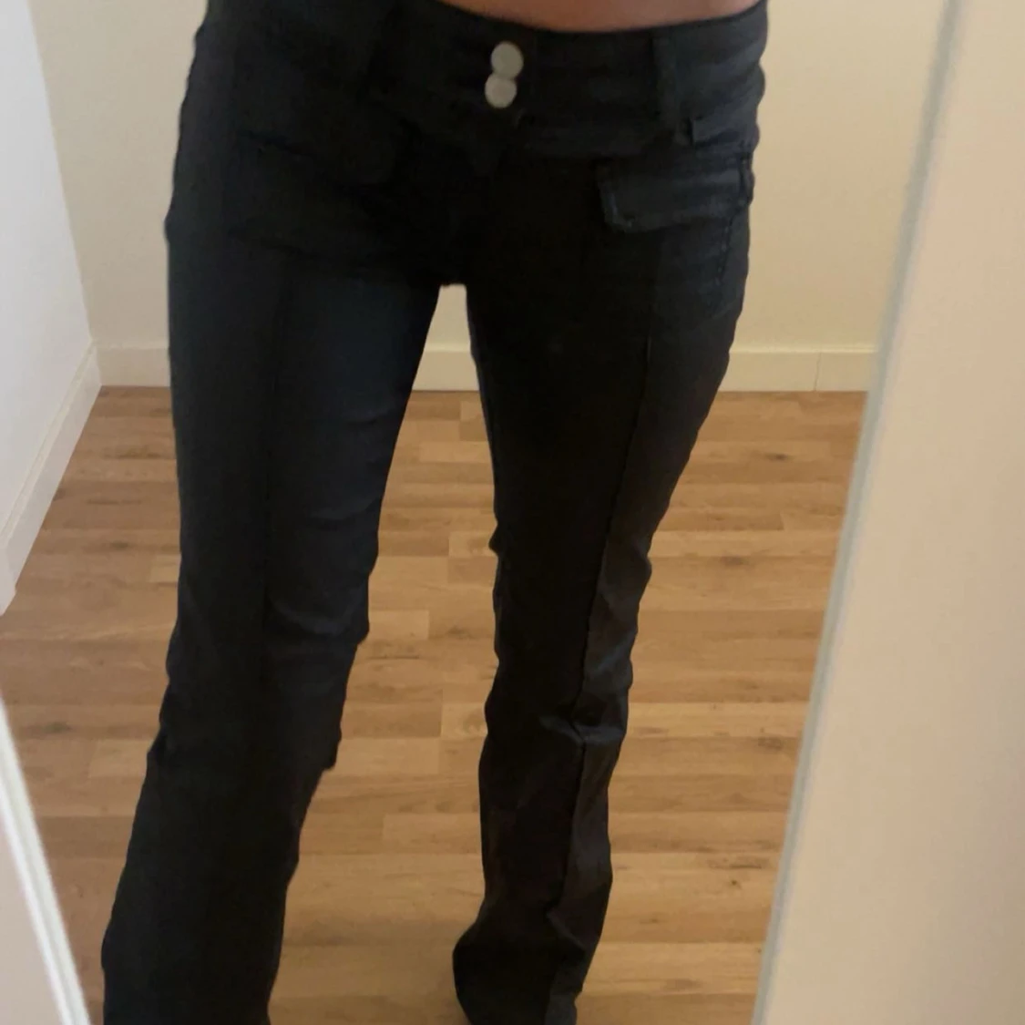 Svarta lågmidjade bootcut-byxor från Nelly - 1