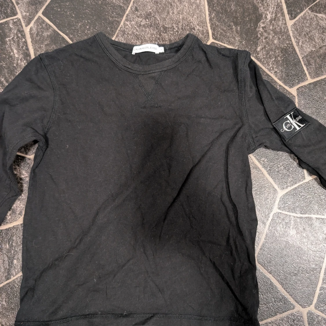 Svart långärmad tröja Calvin Klein Jeans stl 10år