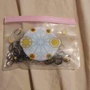 Mini hairties - Over 190 mini hairties. Come in a small salior moon pouch. The pouch is old, but the ties are new