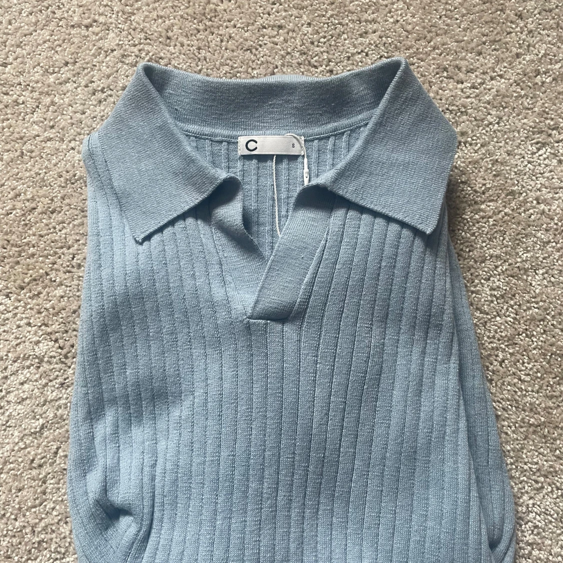 Ljusblå pikétröja från Cubus