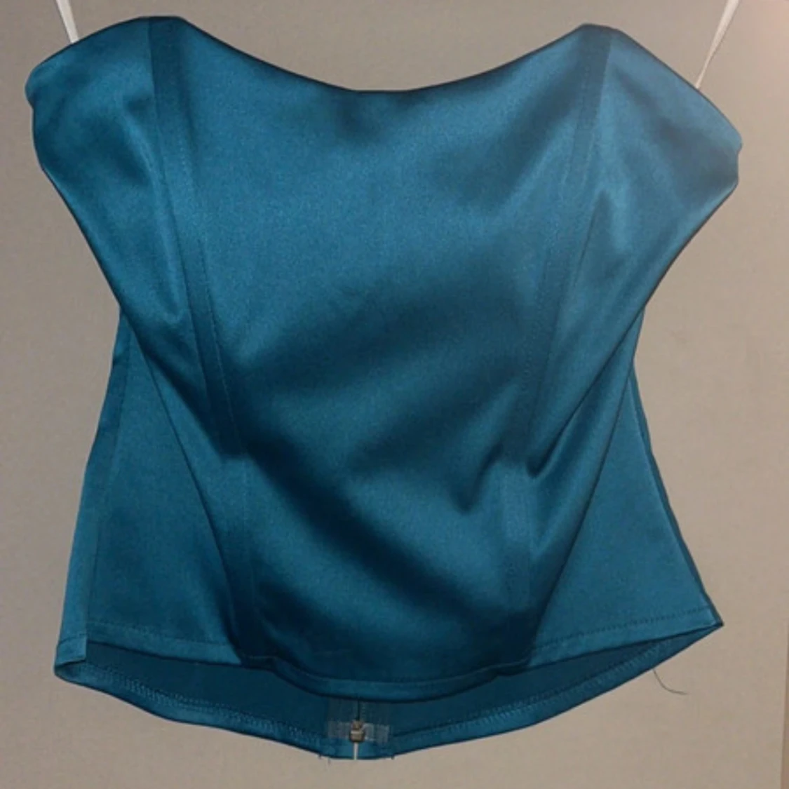 Turkos axelbandslös korsett 