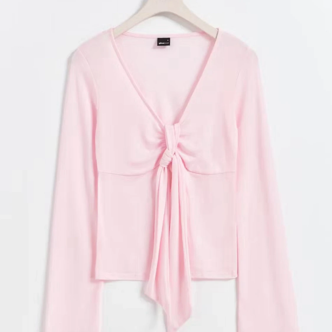 Ljusrosa långärmad knytblus