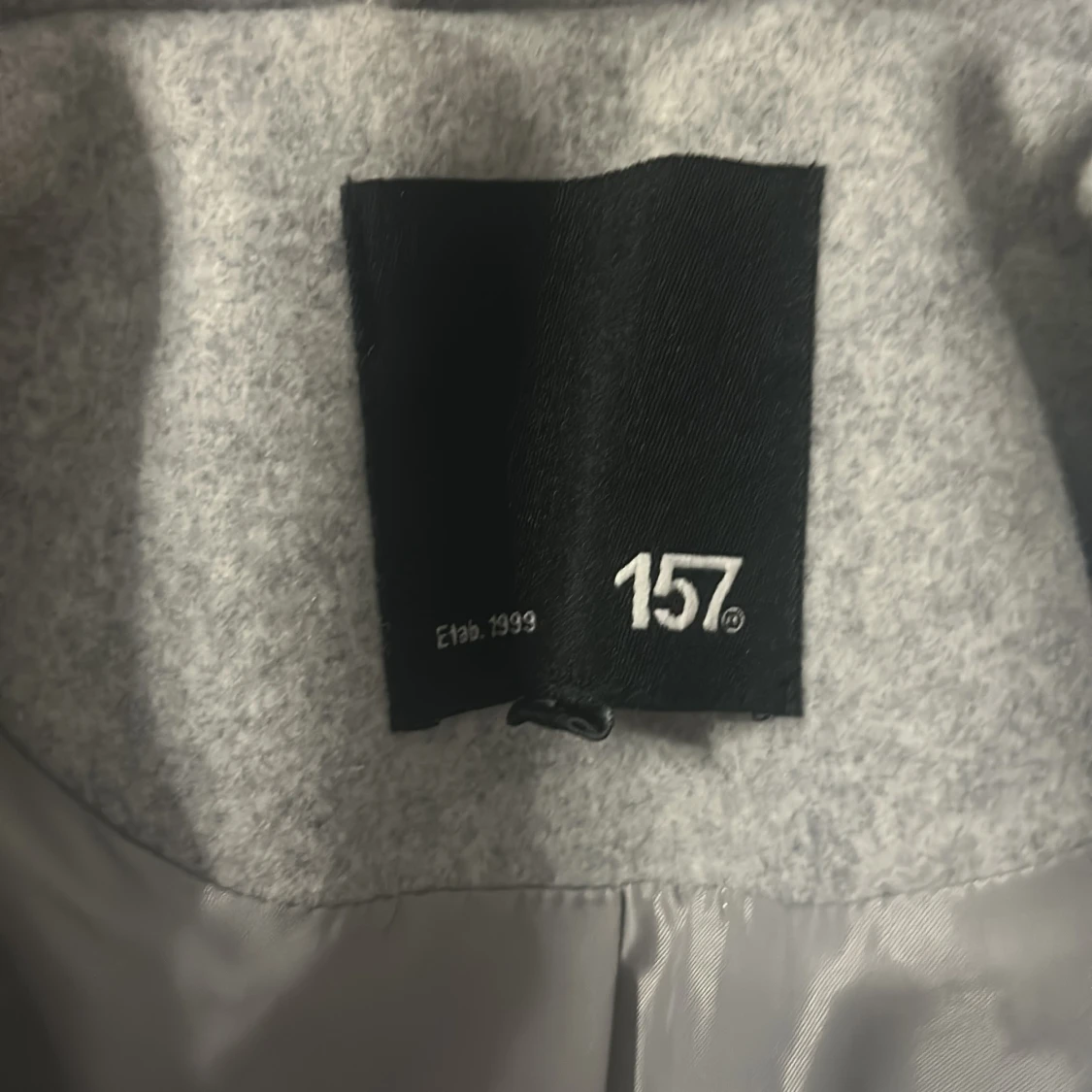 Ljusgrå kappa från 157 - 1