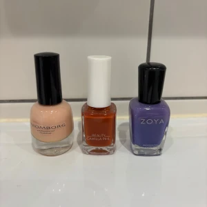 Tre nya nagellack i olika färger från Tromborg, Camilla Pihl och Zoya - Säljer tre snygga nagellack: ett ljusbeige från Tromborg, ett orange från Camilla Pihl Beauty och ett lila från Zoya. Alla har klassisk glasflaska och svart eller vit kork. Perfekta för att variera din nagellook! Hela nya 