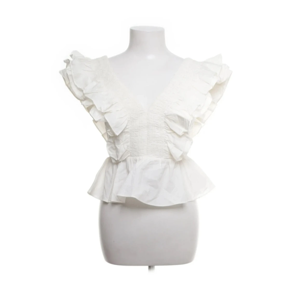 Vit blus med volanger och v-ringning